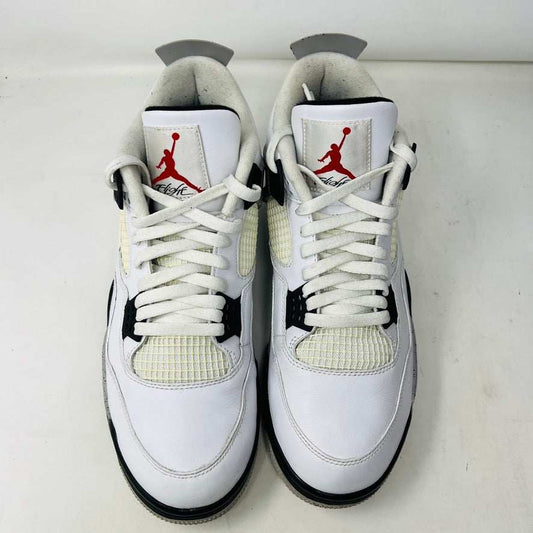 A size 13 Jordan 4 Retro White Cement (2016) sneaker by Jordan is shown on its original black speckled box with an Air Jordan logo. The shoe features clean white uppers with gray and black accents, representing the classic 2016 style.