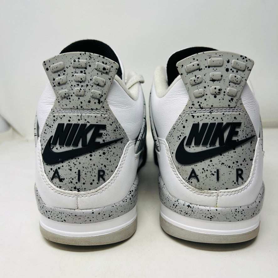 A size 13 Jordan 4 Retro White Cement (2016) sneaker by Jordan is shown on its original black speckled box with an Air Jordan logo. The shoe features clean white uppers with gray and black accents, representing the classic 2016 style.