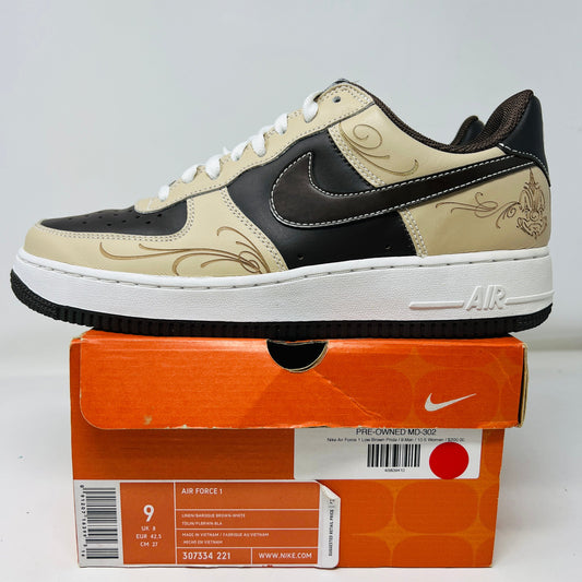 The Nike Air Force 1 Low Brown Pride features a beige and black design with floral patterns on the upper. It has a white midsole, black outsole with light wear, and sits on an orange Nike box in good condition displaying size and style info.