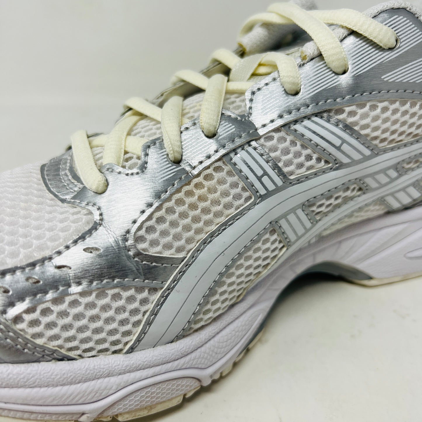 ASICS Gel-Kayano 14 JJJJound Silver White sneaker with clean upper, light wear, in 2021 edition; includes extra laces, on box.