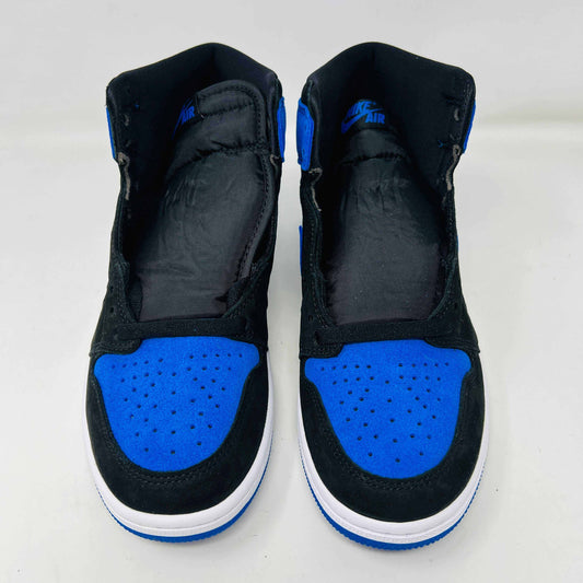 A pair of new Jordan 1 Retro High OG Royal Reimagined sneakers by Jordan rests on a matching box. These genuine shoes have blue accents on the swoosh, heel, and toe cap with a white midsole. The box also features a blue Nike logo.