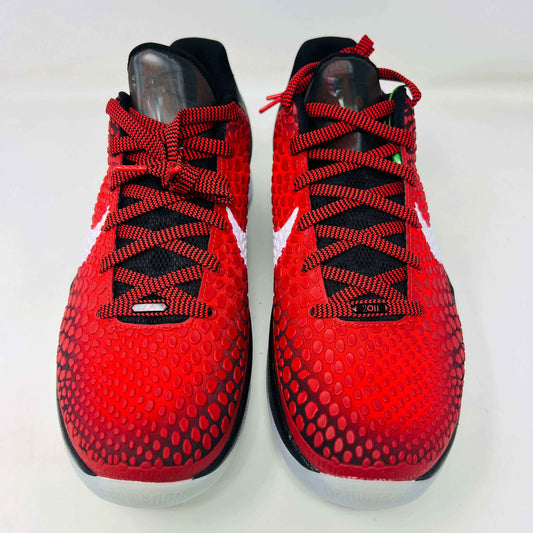 A brand new Kobe Nike Kobe 6 Protro Challenge Red All-Star (2021) sneaker, with a textured pattern and white swoosh, is showcased on a black shoebox. The authentic shoe has a black and white sole, red laces, and ZOOM on the side of the sole.