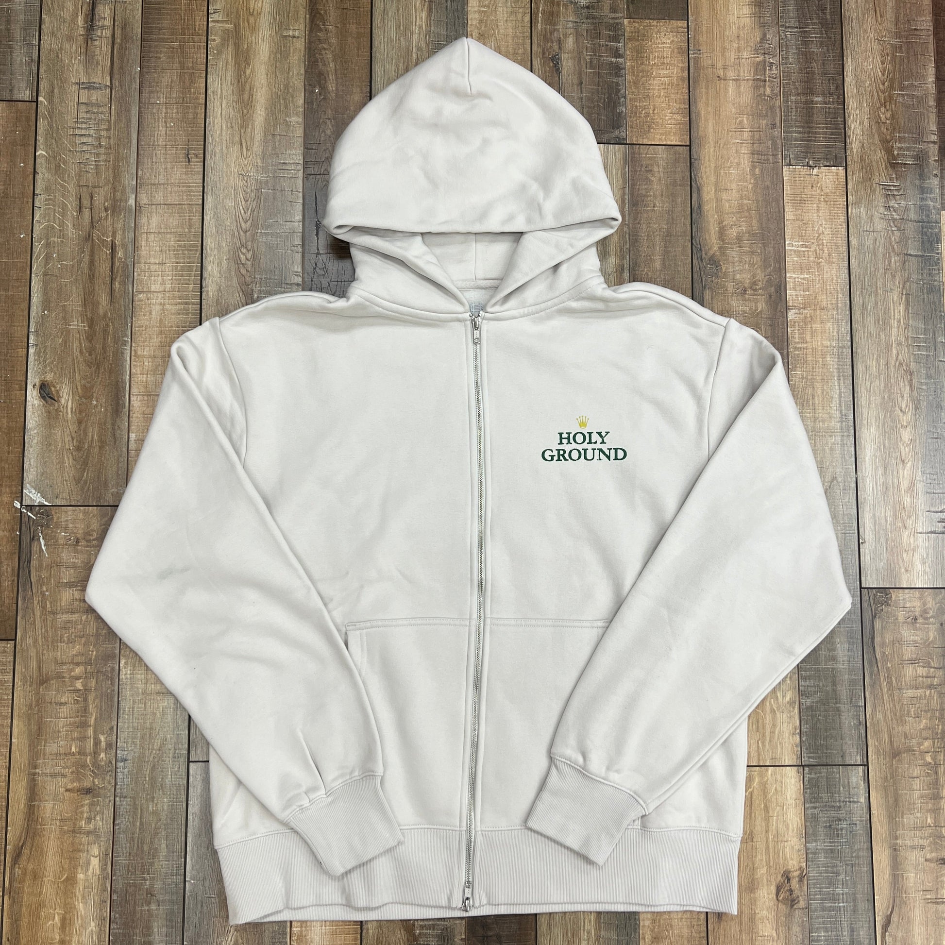 Holy Ground Holex Zip Up Jacket on wooden floor.