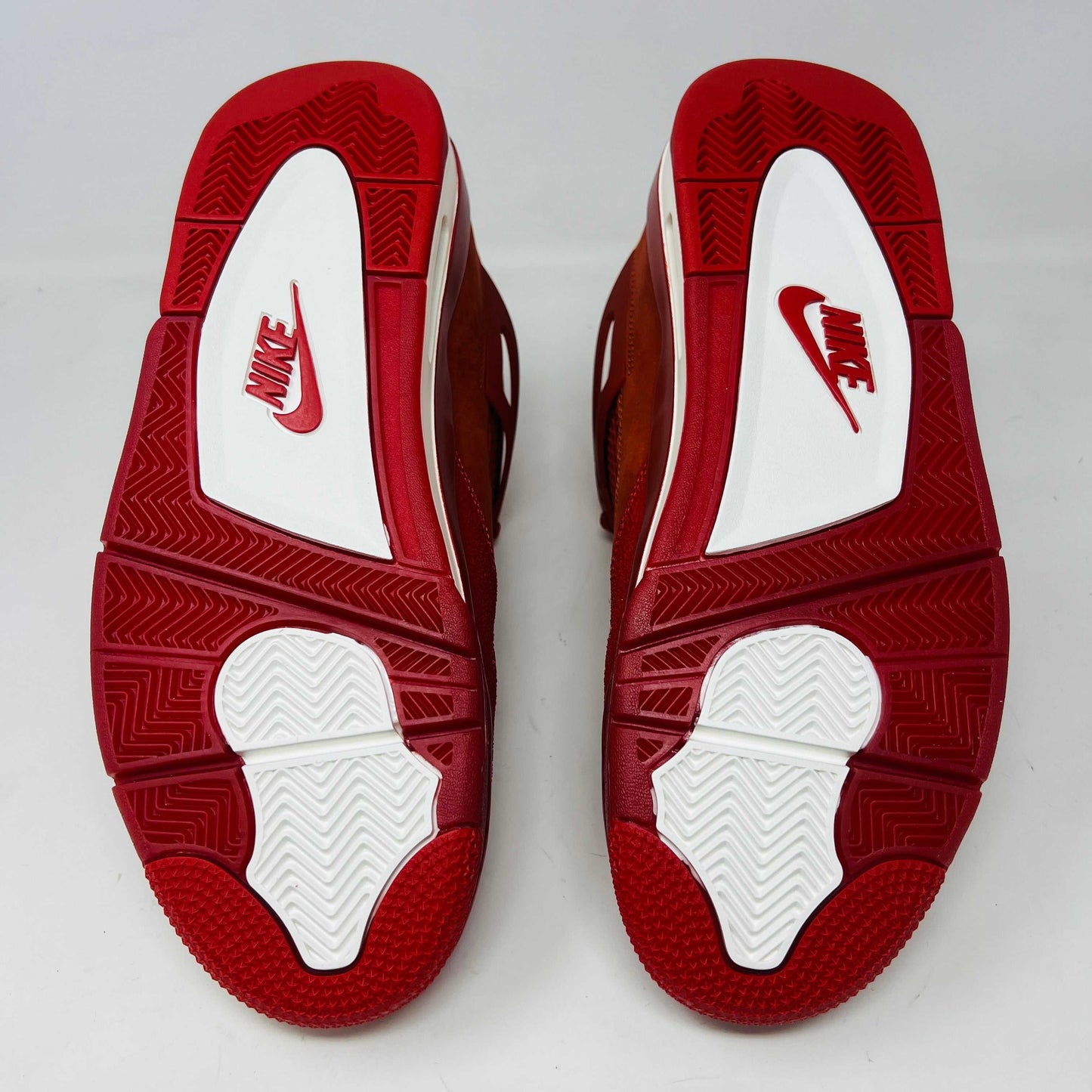 Air Jordan 4 Retro OG SP Nigel Sylvester Brick by Brick sneaker with extra laces and Velcro straps on a textured box.