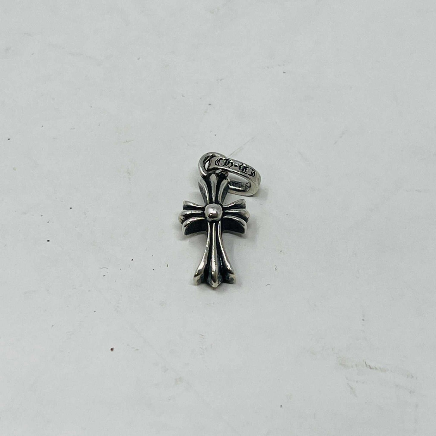 Preowned Chrome Hearts Baby Fat Cross silver pendant on white background