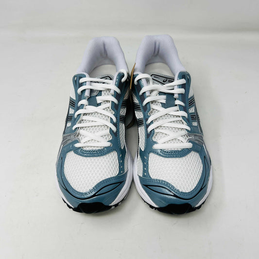 The ASICS Gel-Kayano 14 White Fjord Grey running shoe stands on a brown ASICS box, featuring intricate designs, a breathable mesh upper, and a cushioned thick sole for support. Its 100% authentic.