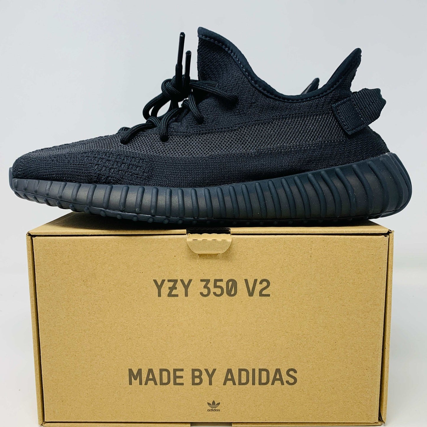 Yeezy 350 V2 Onyx sneakers on box, brand new, 2022 release.