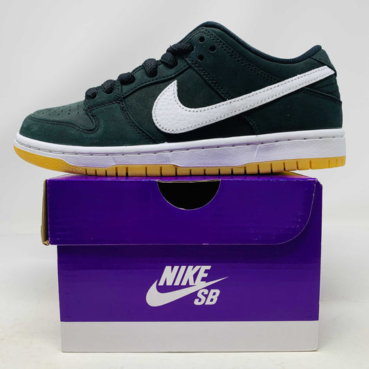 Nike SB Dunk Low Pro Black Gum sneakers, brand new, on purple Nike SB box.