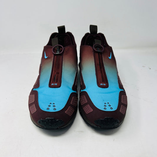 The Nike Air Max Sunder Burgundy Crush Baltic Blue (W) sneakers, released in 2024, feature a gradient design from blue to burgundy with a geometric side pattern and small blue swoosh, displayed against a white background with light wear.