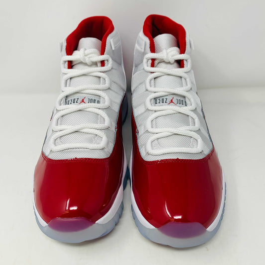 Jordan 11 Retro Cherry (2022) with classic white and red colorway, patent leather, and full-length Air-Sole unit.
