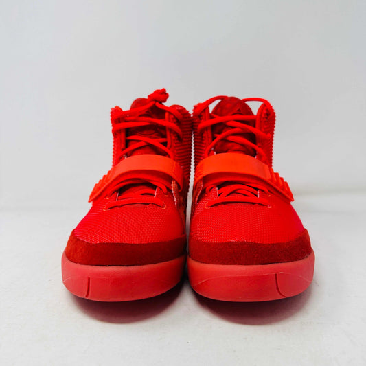 A pair of Nike Air Yeezy 2 Red October high-top sneakers, 100% authentic and brand new, features laces, a midfoot strap, and textured side detailing. Seen from the front against a white background, these bright red shoes showcase their unique style.