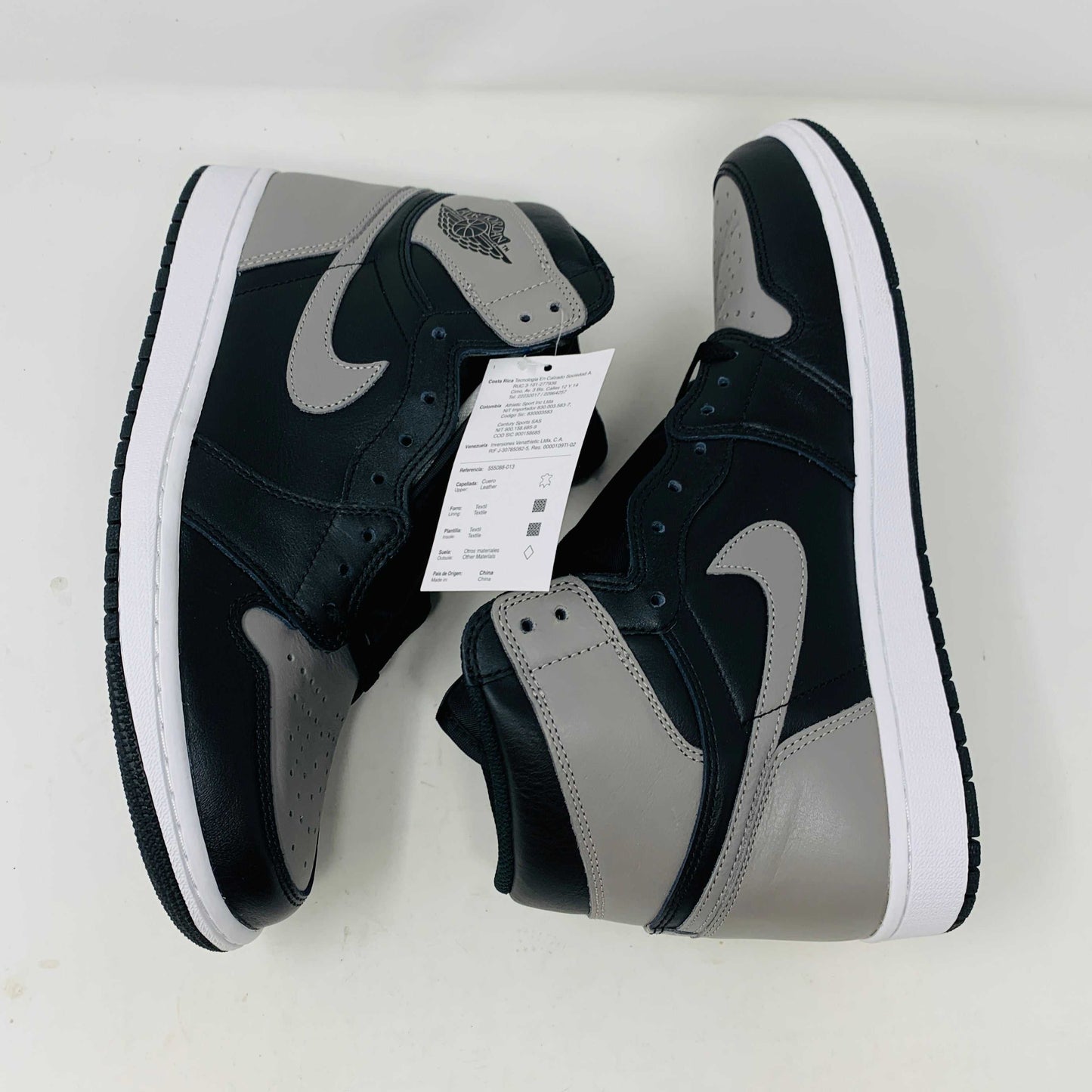 Jordan 1 Shadow 2018 sneakers with grey laces on a Nike box. Brand new condition.
