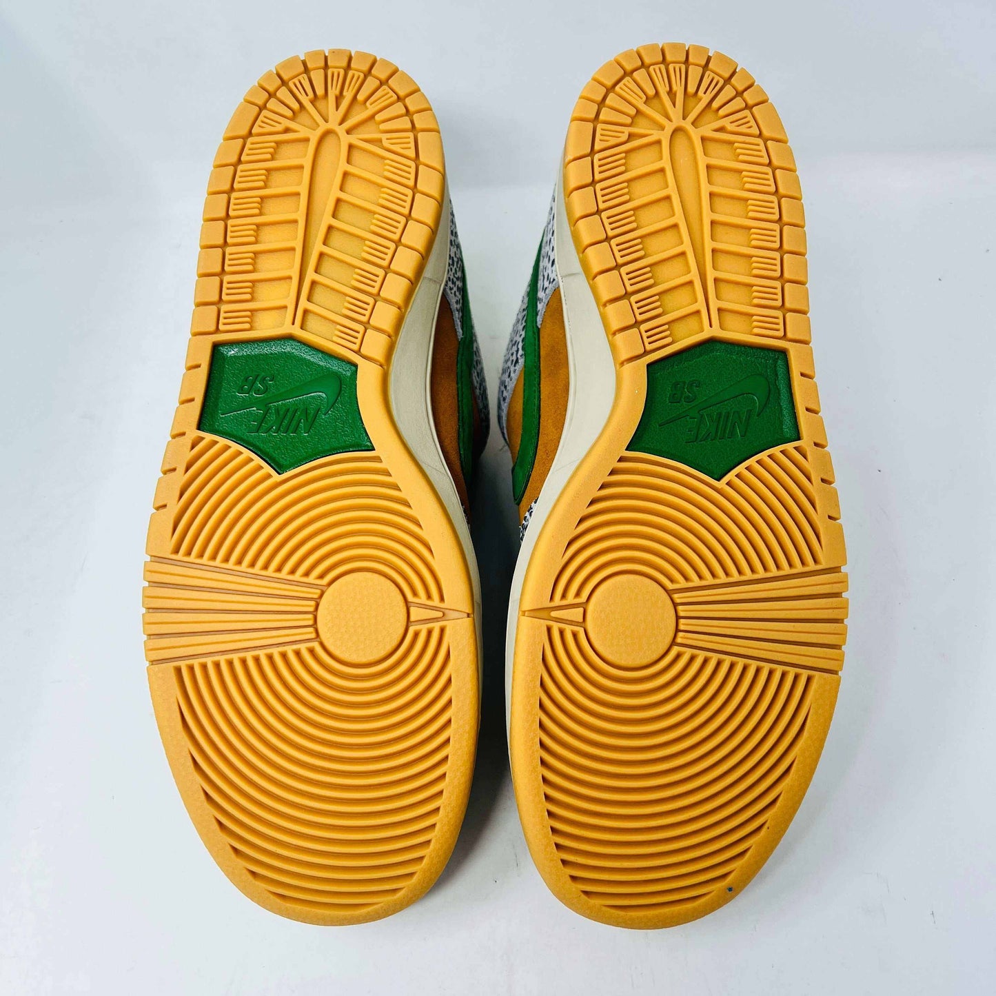 Nike SB Dunk Low Safari sneakers with orange soles and green accents, 2020 release.