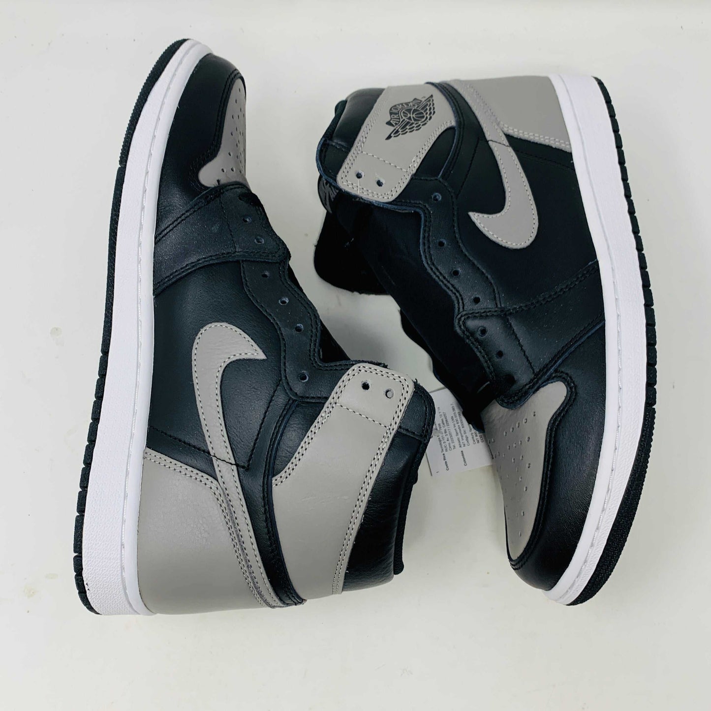 Jordan 1 Shadow 2018 sneakers with grey laces on a Nike box. Brand new condition.
