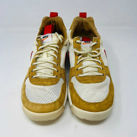 The NikeCraft Mars Yard Shoe 2.0 by Tom Sachs Space Camp features white mesh, tan suede accents, red Nike logos on the tongues, red heel pull tabs, and white laces. This 100% authentic sneaker is perfect for elevating any outfit with style.