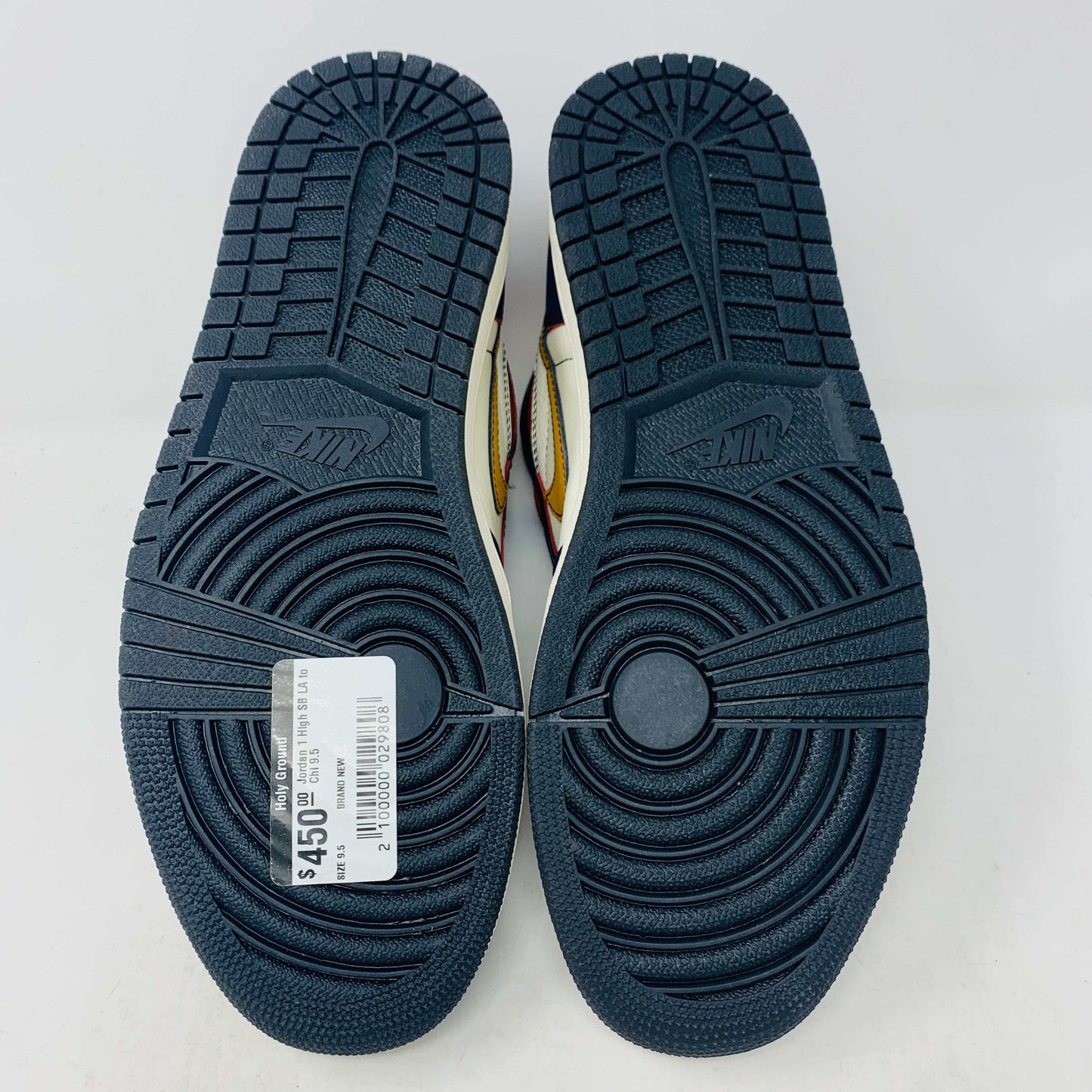 A brand new Jordan 1 High SB LA to Chi sneaker rests on a black Jordan box with a red logo. This authentic high-top shoe features multi-colored accents of purple, yellow, white, and red, with the label proudly reading 1985 Air Jordan 1.