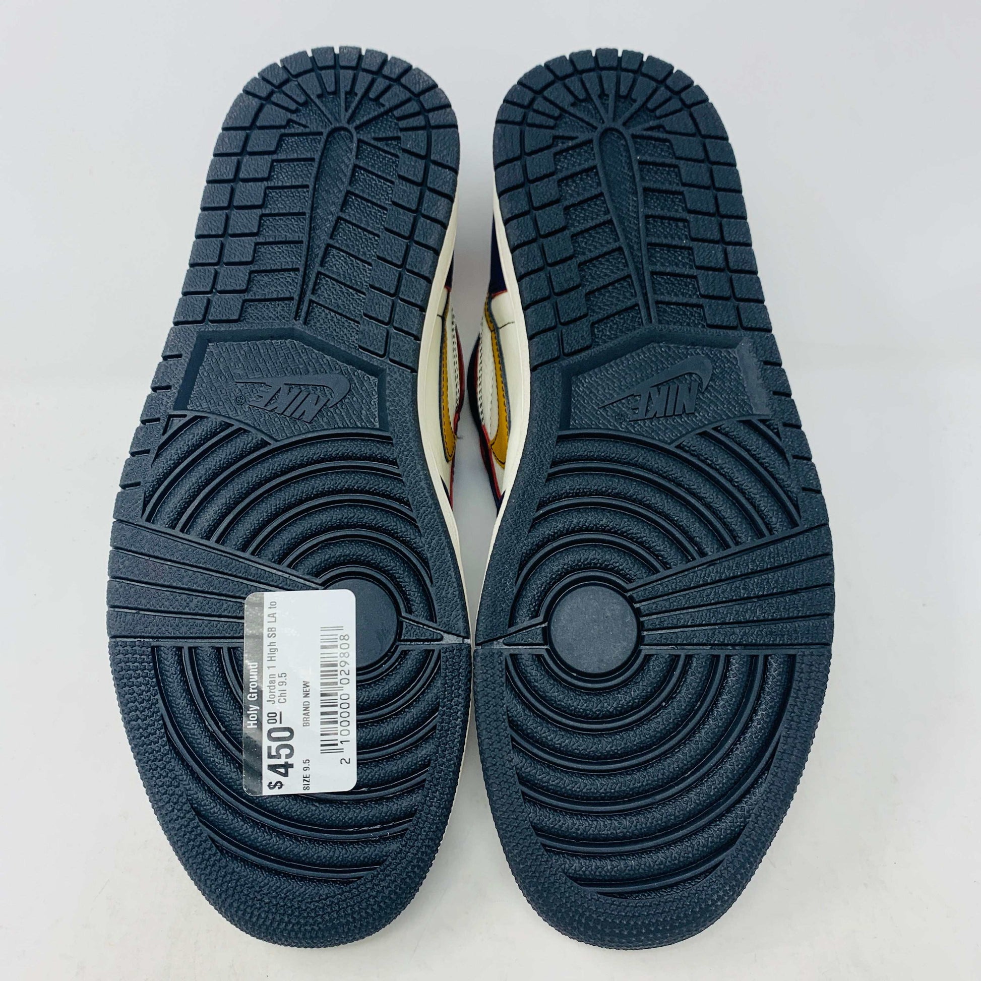 A brand new Jordan 1 High SB LA to Chi sneaker rests on a black Jordan box with a red logo. This authentic high-top shoe features multi-colored accents of purple, yellow, white, and red, with the label proudly reading 1985 Air Jordan 1.