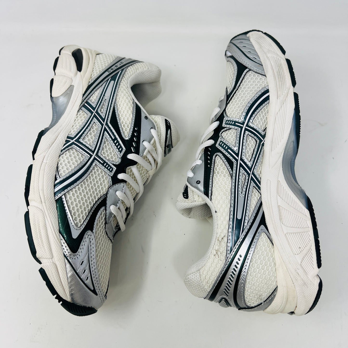 An ASICS GT-2160 Kith Cream Scarab (2023) running shoe with a clean cream and scarab-colored mesh design featuring black accents sits on a brown box. Priced at $350, the box in good condition details sizing and brand logos.