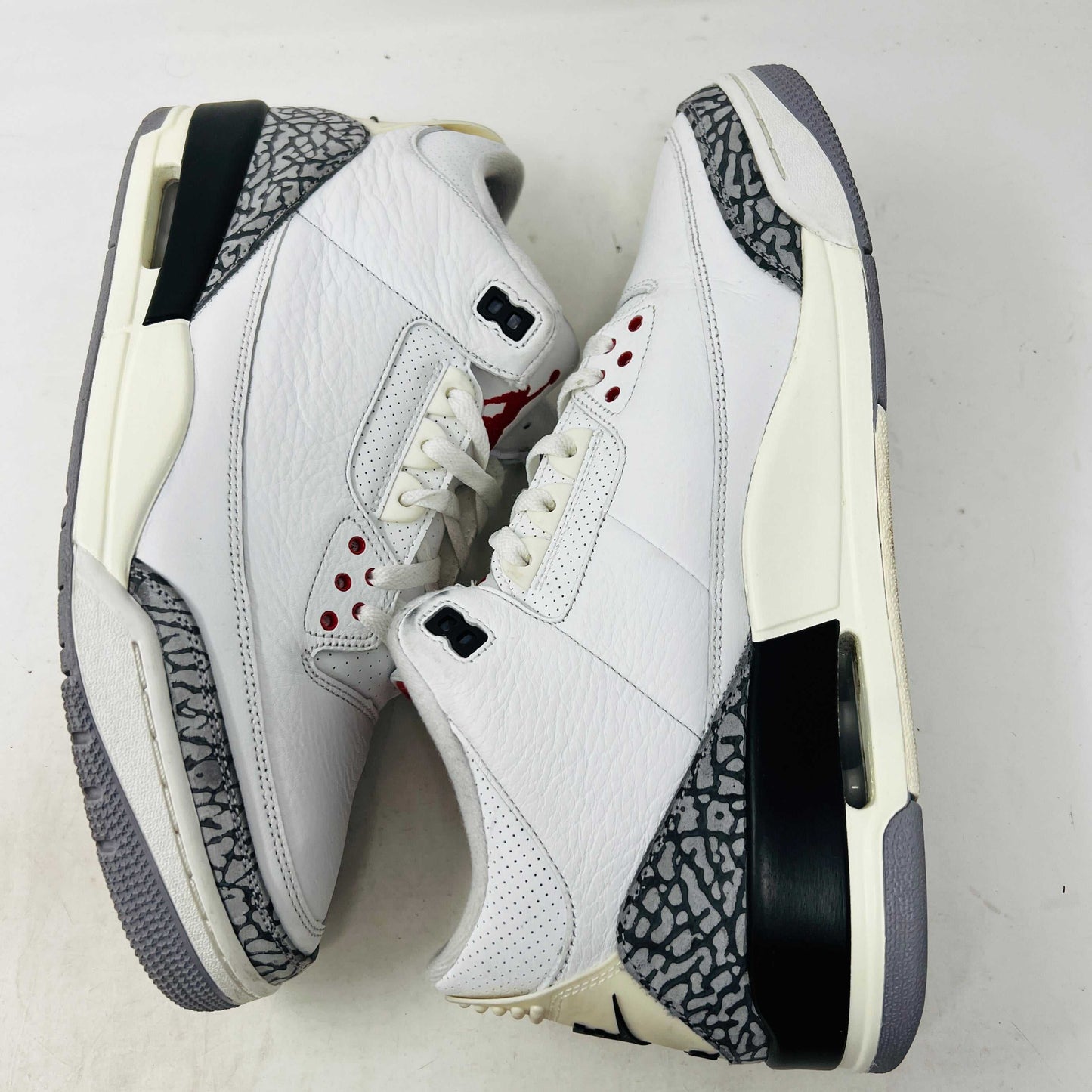 Jordan 3 Retro White Cement Reimagined sneaker on Nike box, 2023 release.