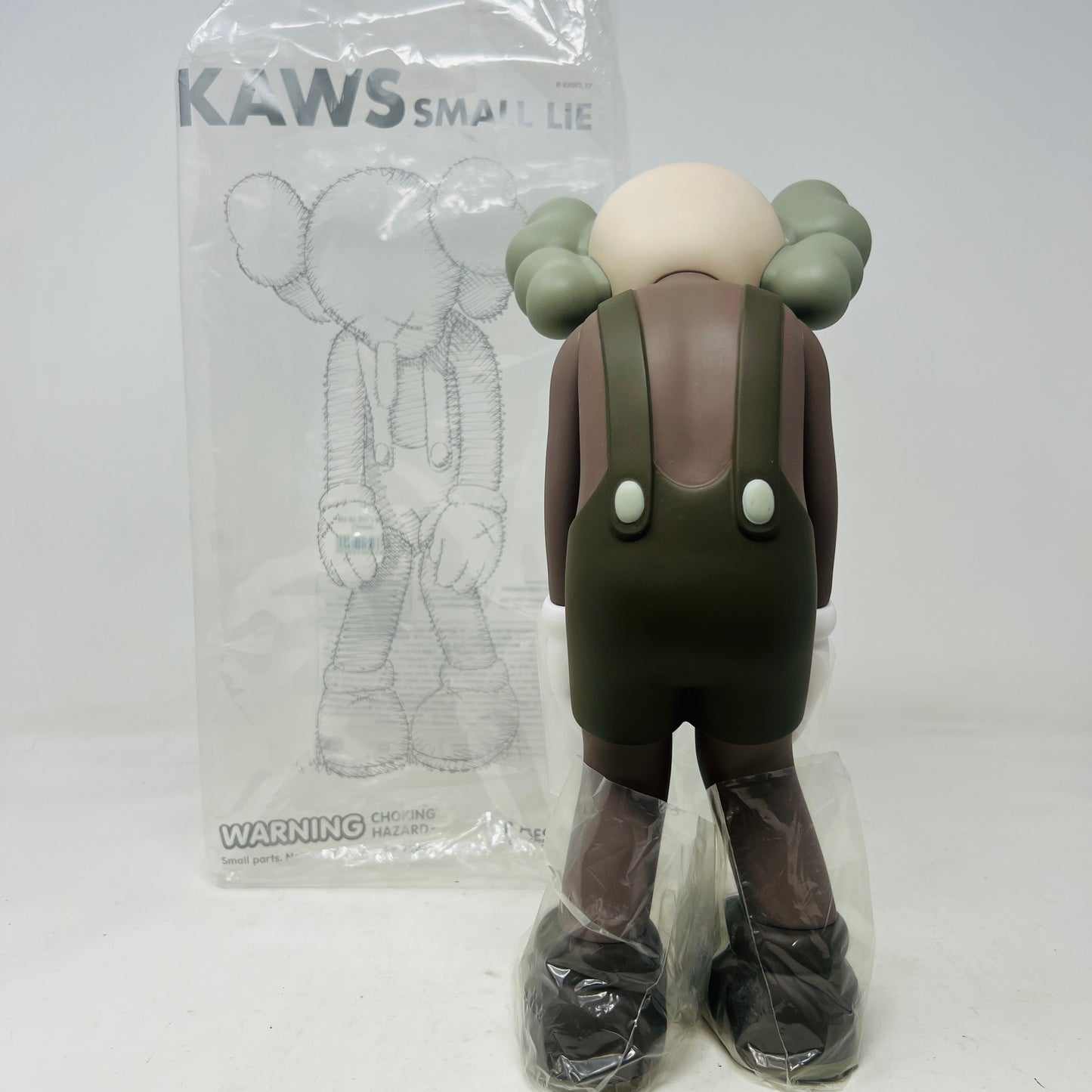 KAWS Small Lie Companion Vinyl Figure Brown