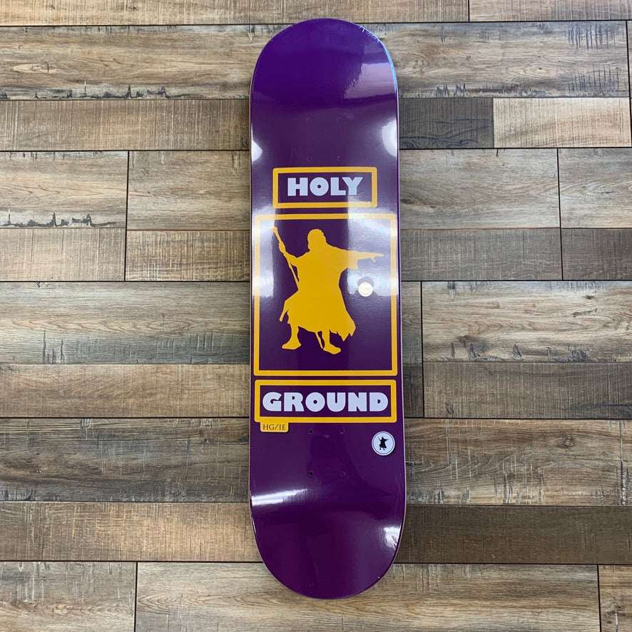 Holy Ground Laker Skate Deck with iconic Laker logo on wooden background.
