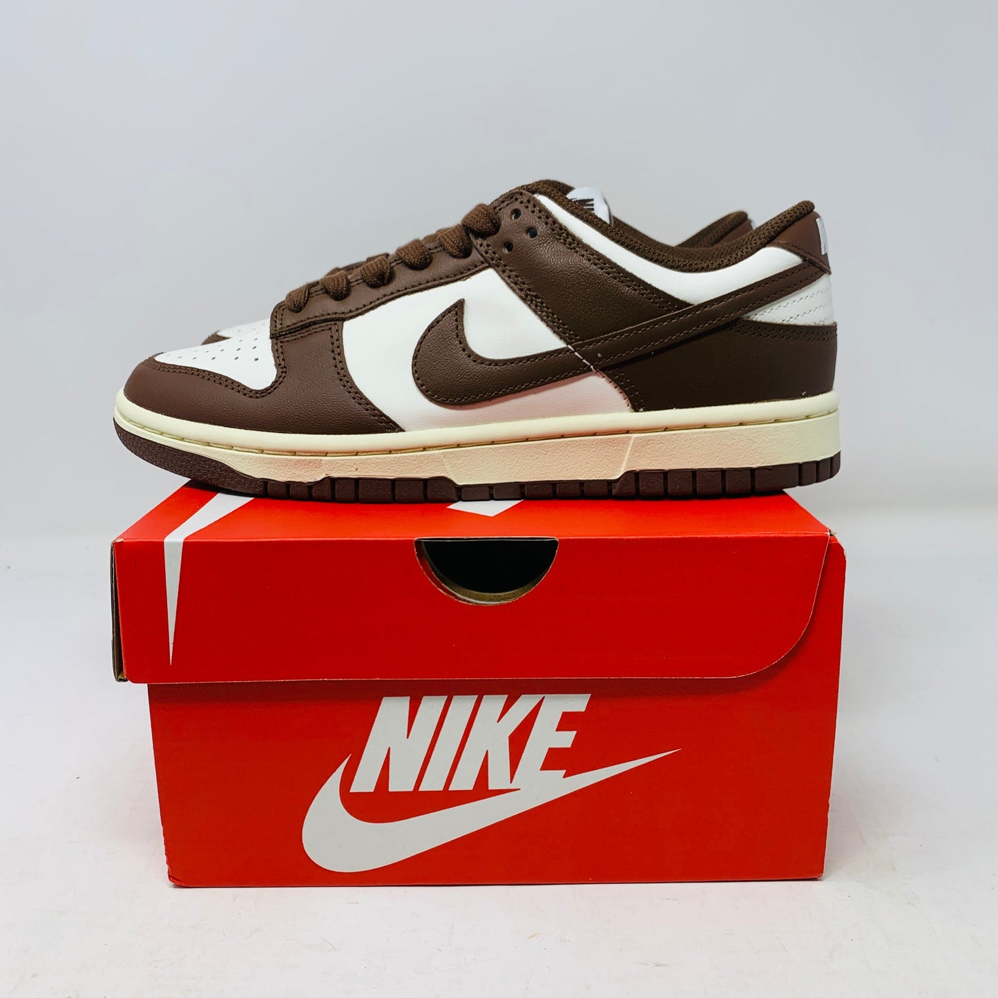 Nike Dunk Low Cacao Wow Women's sneakers 2023, displayed on red Nike box.