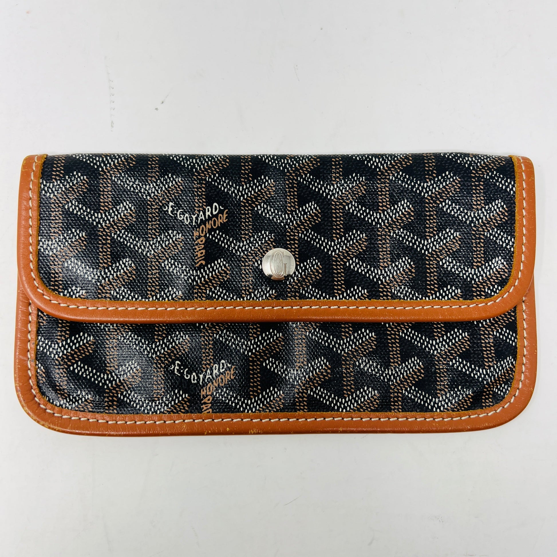 Goyard Saint Louis Pouch, preowned condition with signature pattern and brown trim.