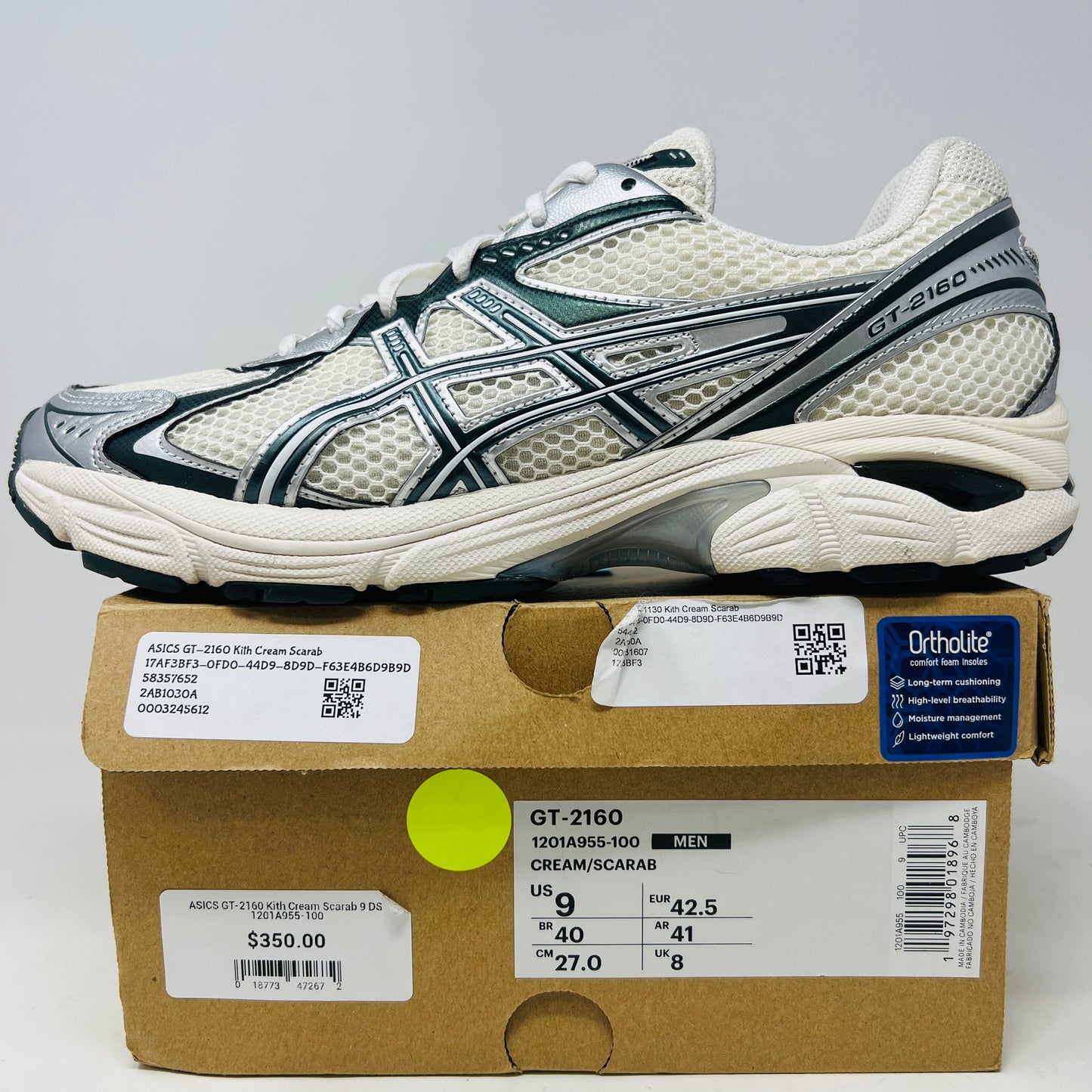 An ASICS GT-2160 Kith Cream Scarab (2023) running shoe with a clean cream and scarab-colored mesh design featuring black accents sits on a brown box. Priced at $350, the box in good condition details sizing and brand logos.