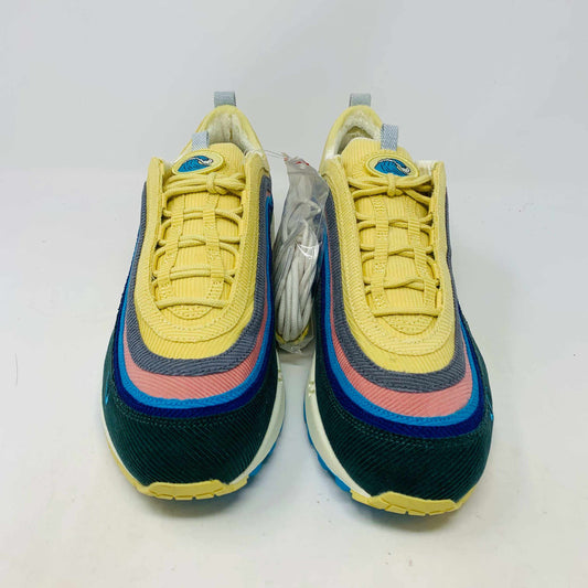 Nike Air Max 1/97 SW Sean Wotherspoon sneakers are displayed on a red Nike box, with authentic extra blue and yellow laces in plastic bags in front. The brand-new shoes feature a wave-like design with vibrant colors.