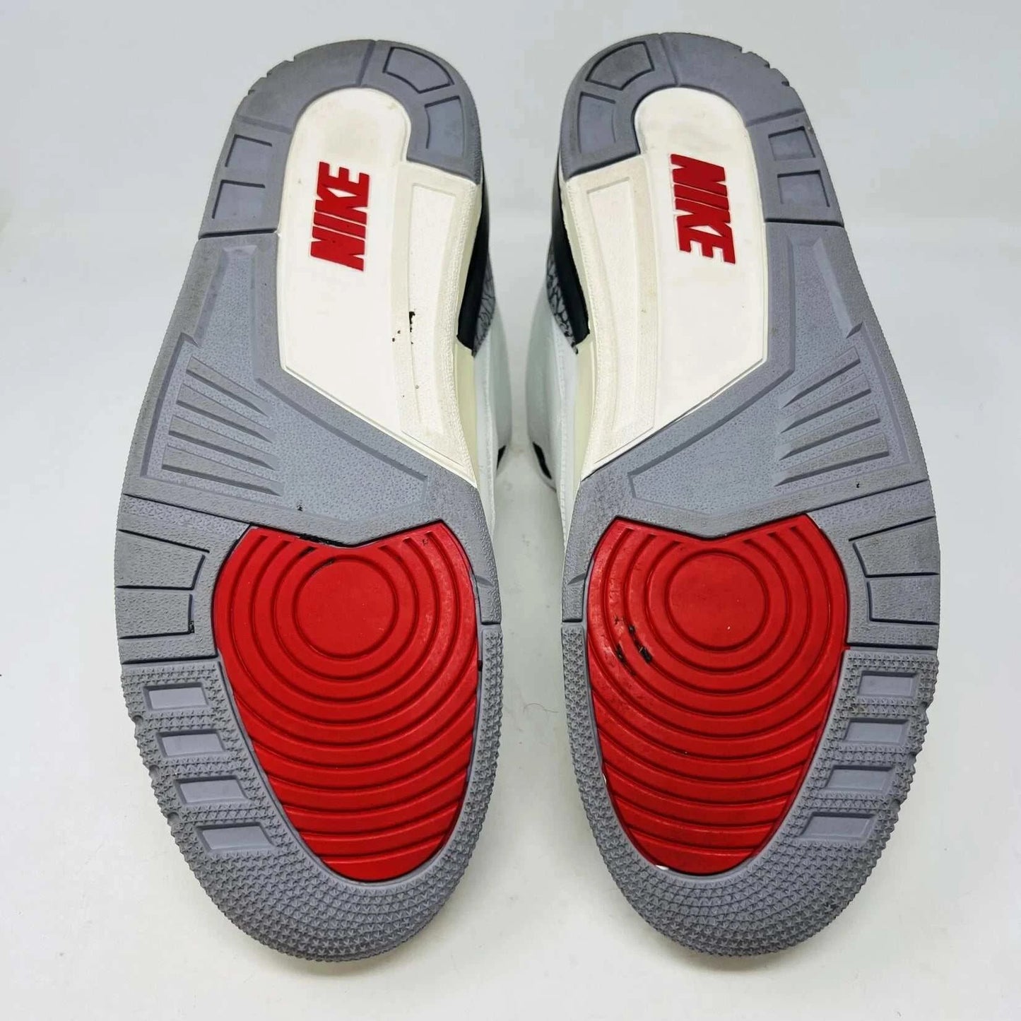 The Jordan 3 Retro White Cement Reimagined sneaker, size 13, features authentic quality with elephant print accents, black and red details, and a visible air unit. It comes in a matching Nike Air shoebox highlighting branding details.
