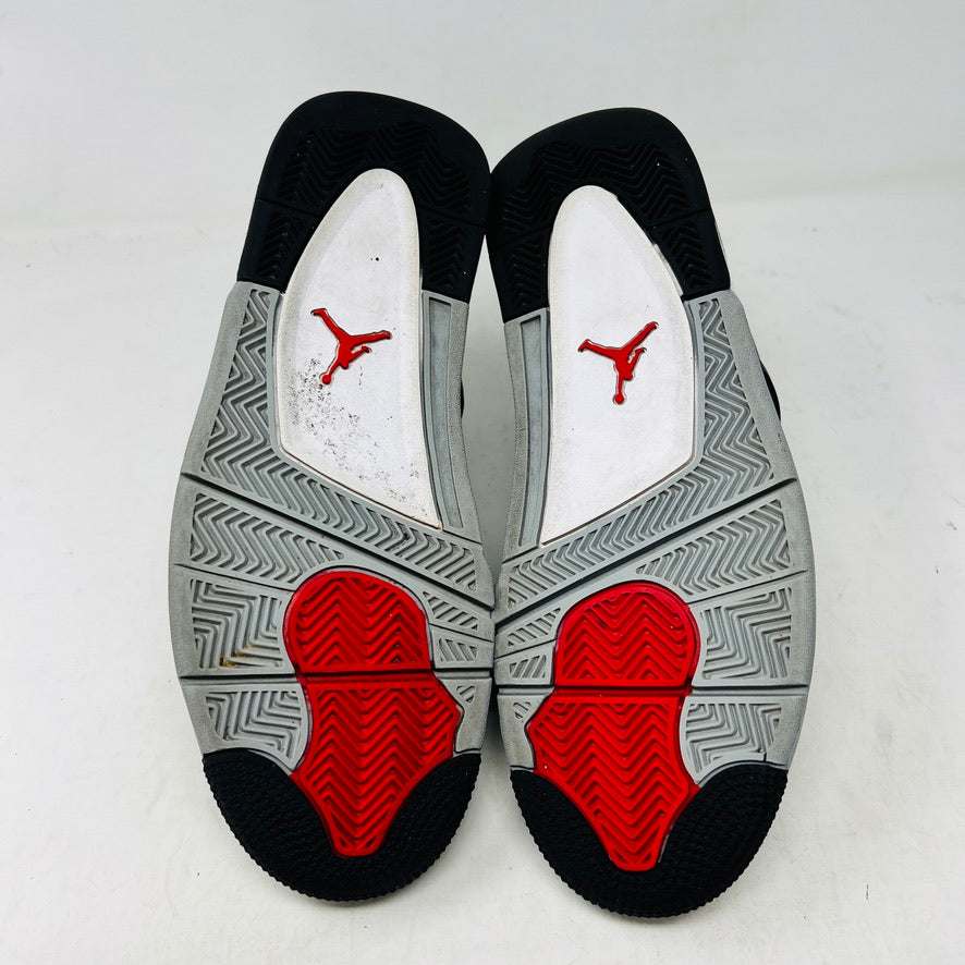 A Jordan 4 Retro SE Black Canvas sneaker in 8/10 condition sits on its shoebox. It features netted side panels, a visible air unit in the heel, and a Jumpman logo on the tongue. The box is marked with size 9.5 and style details.