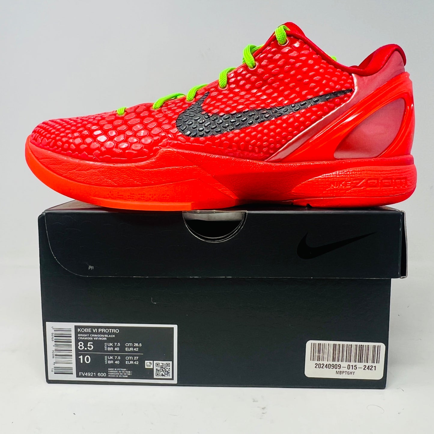 Nike Kobe 6 Protro Reverse Grinch sneakers, red with black swoosh, on box, 2023 model.