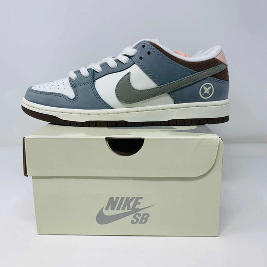 Nike SB Dunk Low Yuto Horigome sneakers, brand new, with extra pink and brown laces, displayed on box.