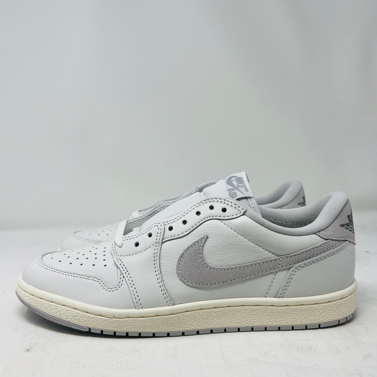 Jordan 1 Retro Low '85 Neutral Grey sneakers, 2024 release, brand new condition.