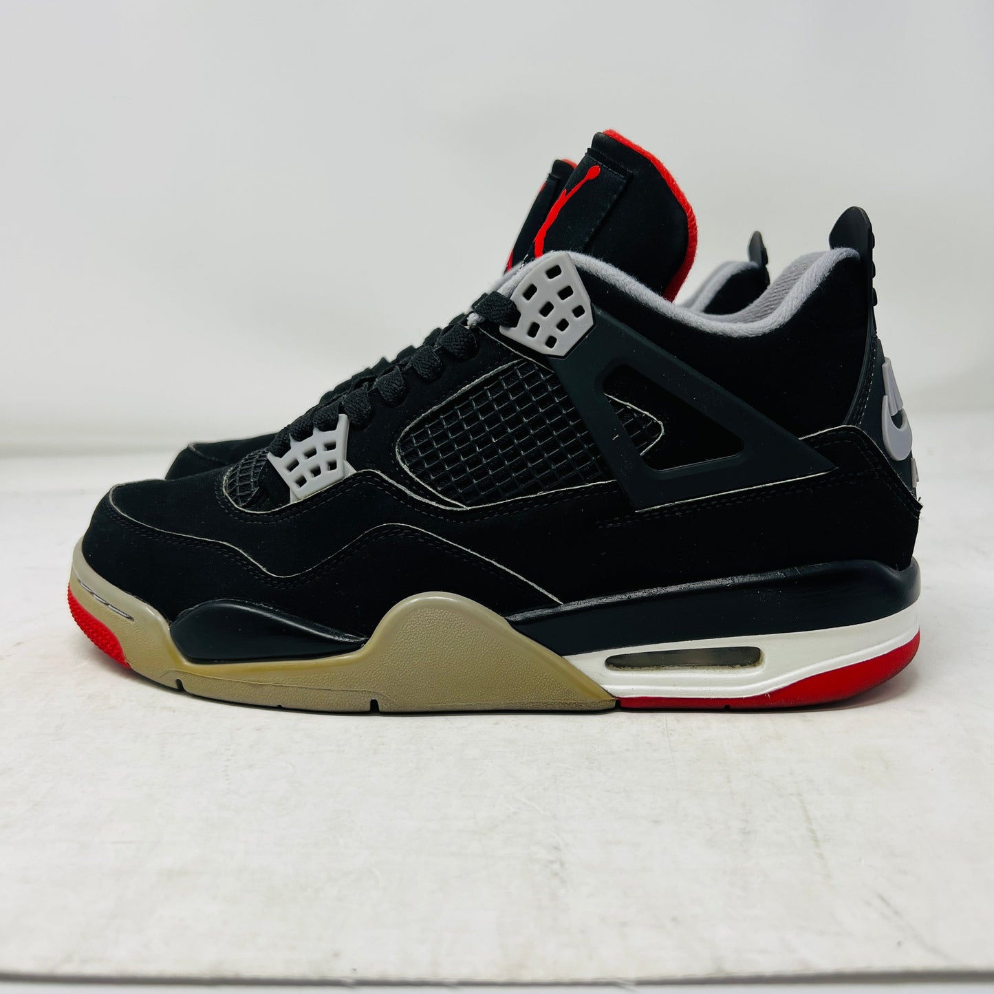 Jordan 4 Retro Bred 2019 sneakers with custom white lining, condition 8.5/10.