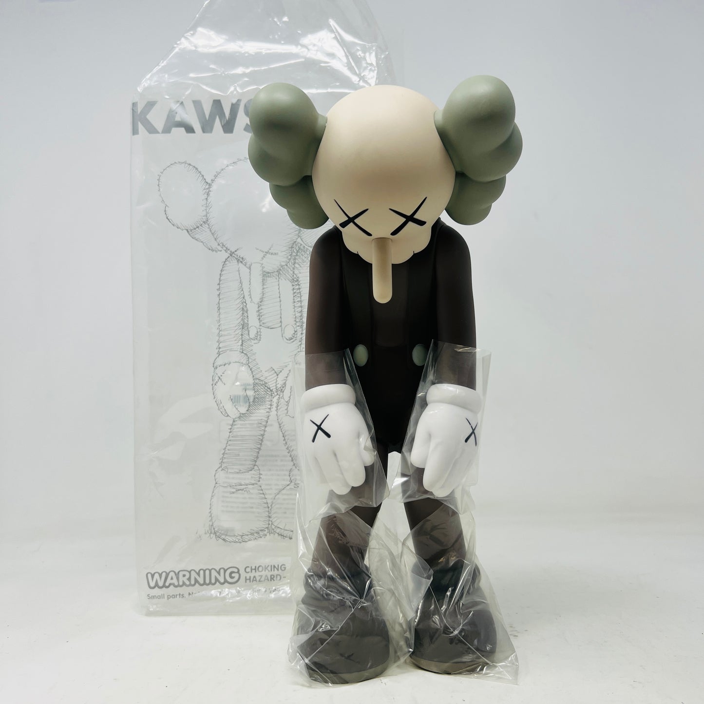 KAWS Small Lie Companion Vinyl Figure Brown