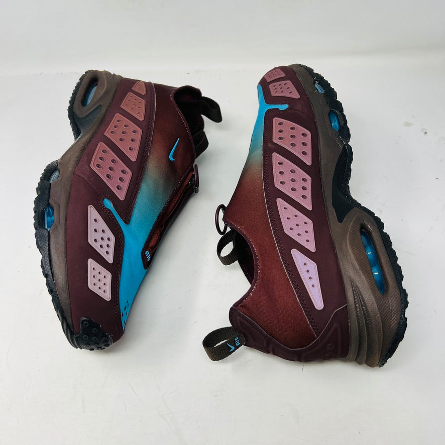 The Nike Air Max Sunder Burgundy Crush Baltic Blue (W) sneakers, released in 2024, feature a gradient design from blue to burgundy with a geometric side pattern and small blue swoosh, displayed against a white background with light wear.