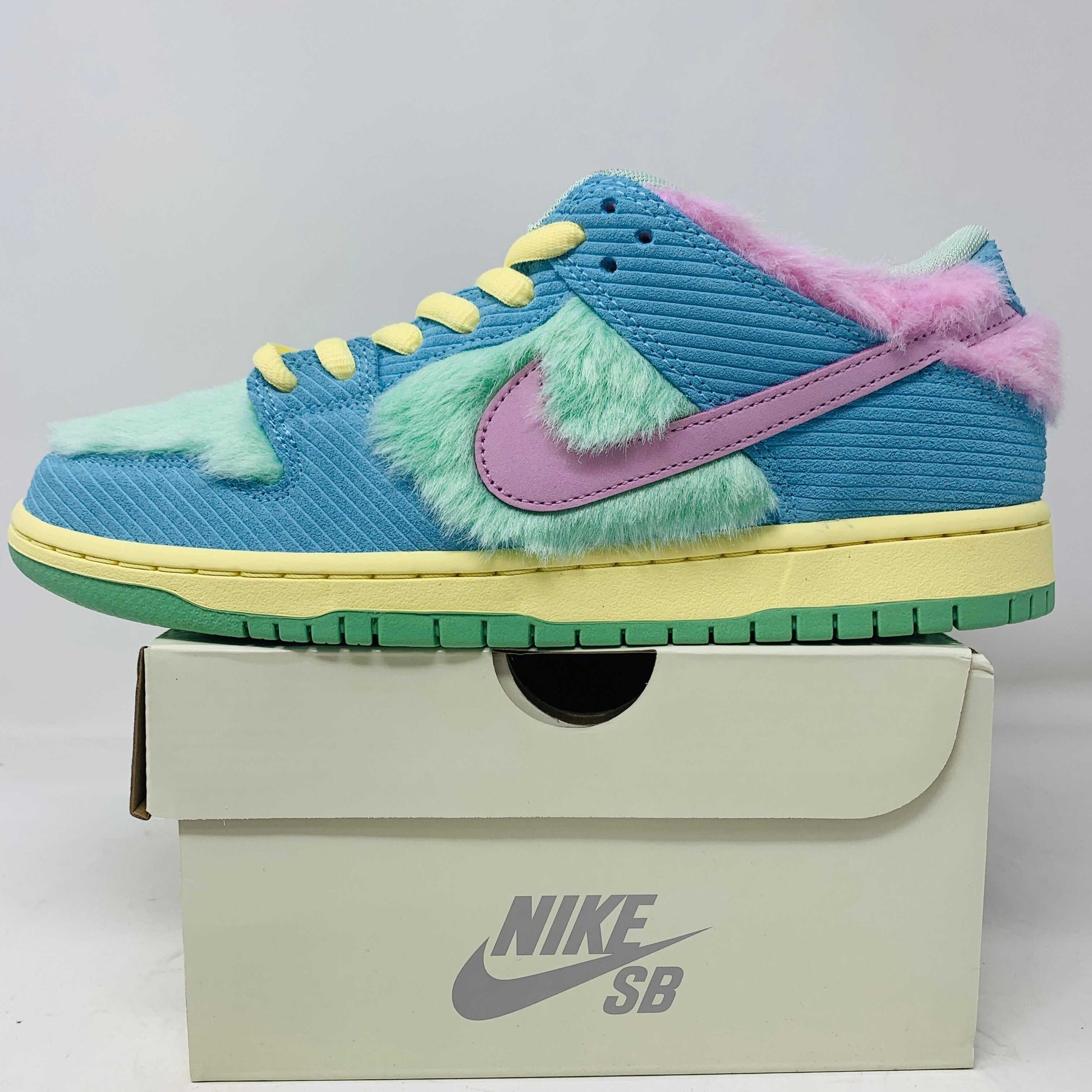 Nike SB Dunk Low Verdy Visty sneakers in blue with pastel accents, displayed on box.