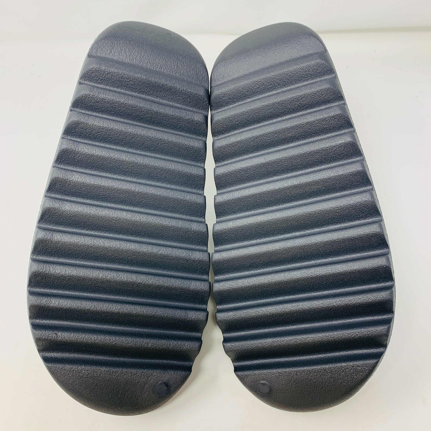 Adidas Yeezy Slide Granite, sleek granite colorway, sporty Adidas logo, high-quality materials, versatile footwear.