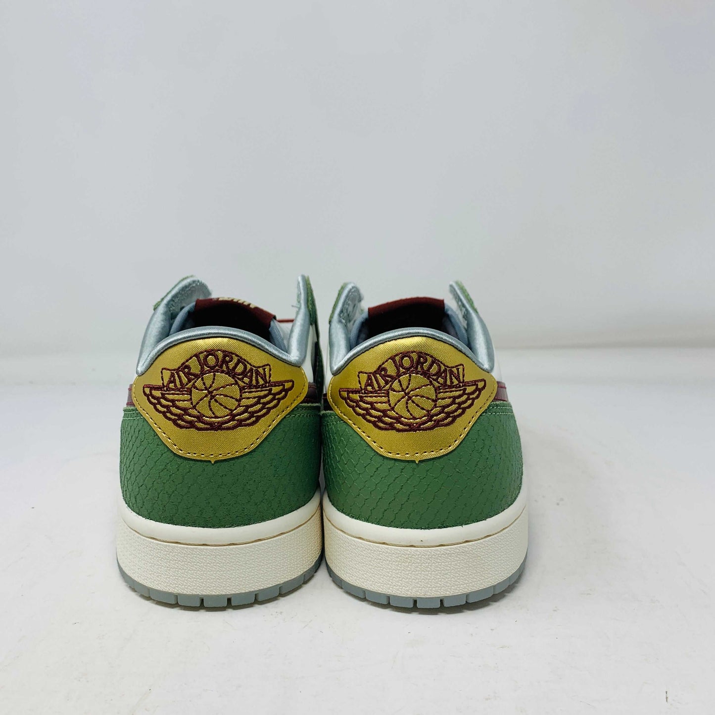 Jordan 1 Low Year Of The Dragon 2024 sneakers, brand new condition, green and gold details, authentic.