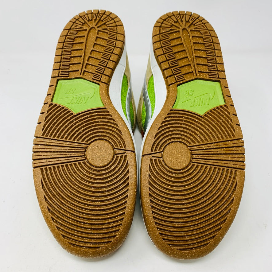 Nike SB Dunk Low Escargot shoes 2024 with green accents and brown soles shown from the bottom.