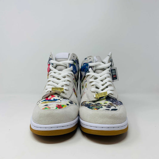 The Nike SB Dunk High Supreme Rammellzee, a 2023 release, sports a vibrant, abstract design. It features an off-white upper with a gum sole and sits atop a Nike SB shoe box. A World Famous tag affirms authenticity, making it ideal for collectors and enthusiasts.