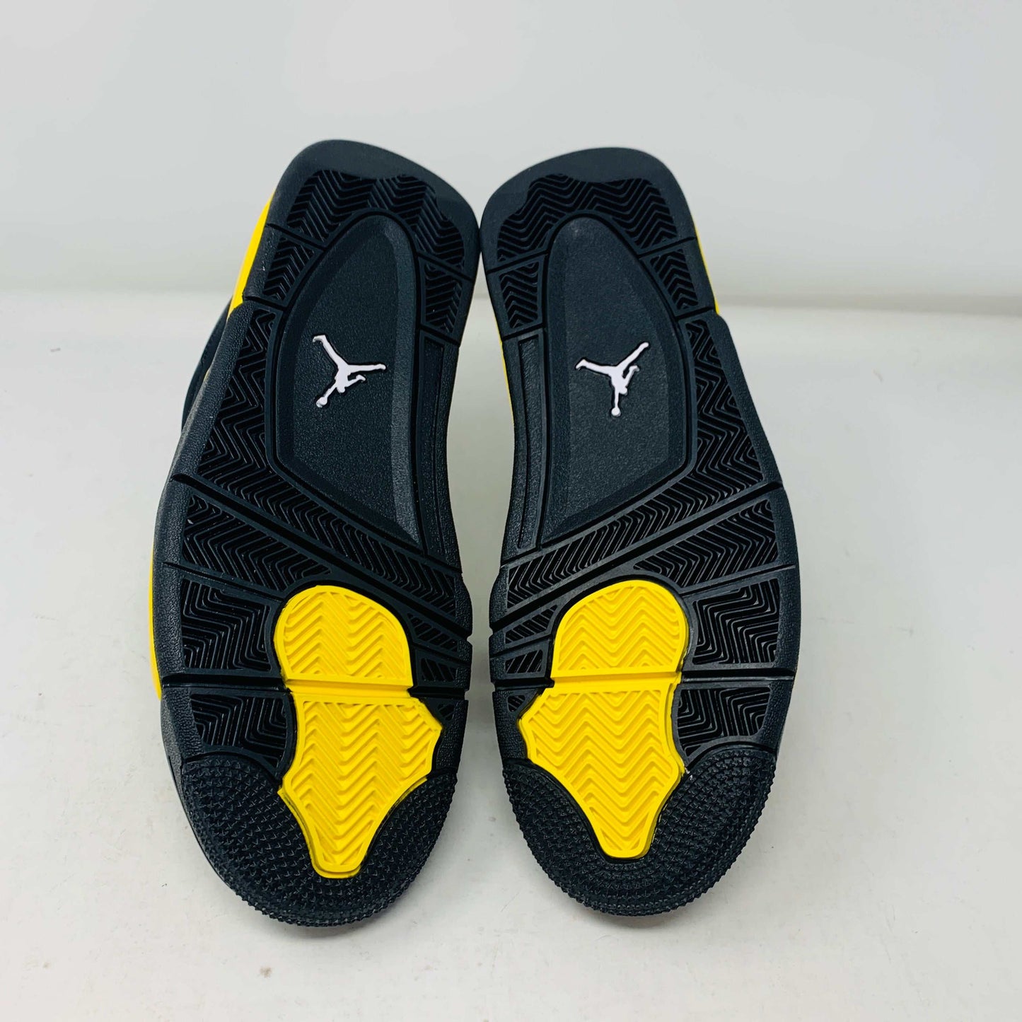 Jordan 4 Thunder 2023, brand new condition, black and yellow sole.
