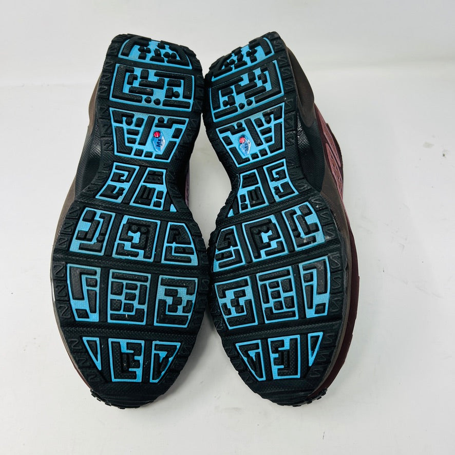 The Nike Air Max Sunder Burgundy Crush Baltic Blue (W) sneakers, released in 2024, feature a gradient design from blue to burgundy with a geometric side pattern and small blue swoosh, displayed against a white background with light wear.