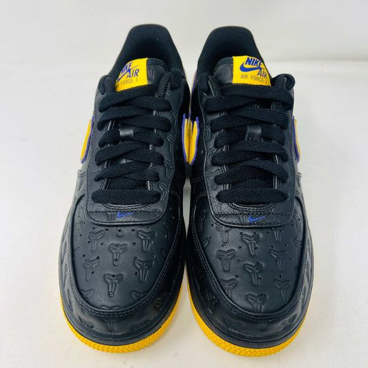 The new black Nike Air Force 1 Low Kobe Bryant Lakers Away sneakers have yellow accents like a swoosh and sole, sitting on a white box with the Nike logo and icon. These 100% authentic shoes are available as a final sale item.