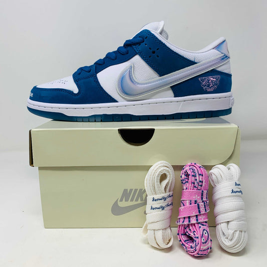 Nike SB Dunk Low Born X Raised sneakers with extra white, cream, and pink laces on shoe box.
