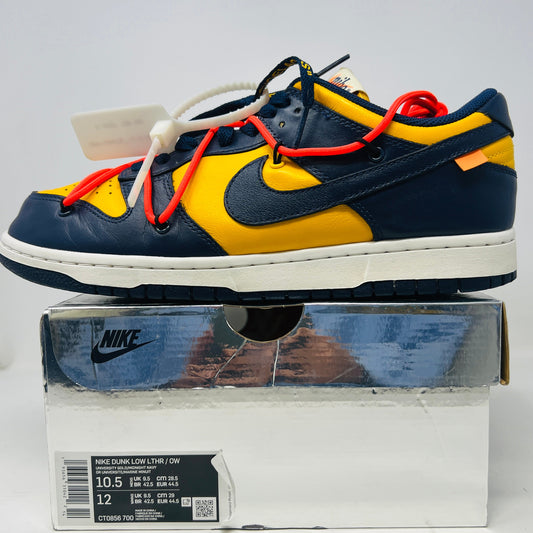 Nike Dunk Low Off-White University Gold shoes with zip tie, yellowing midsole, and box.