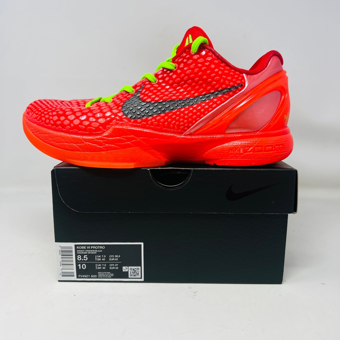 Nike Kobe 6 Protro Reverse Grinch sneakers in red with neon green laces, 2023 model.
