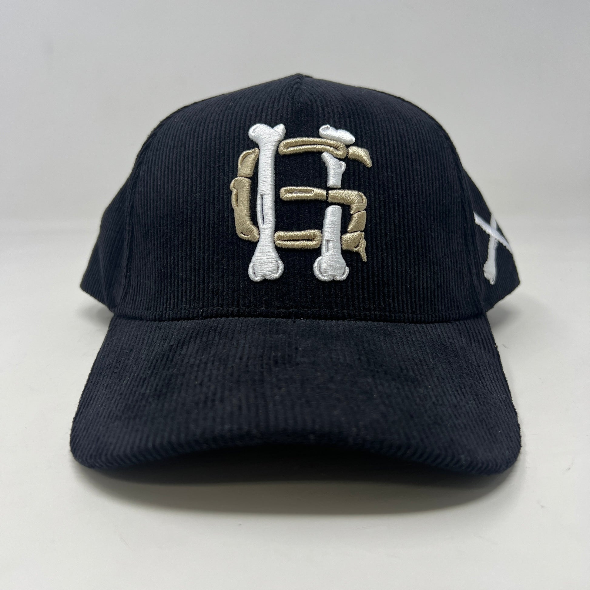 Holy Ground Bones Hat in black corduroy.