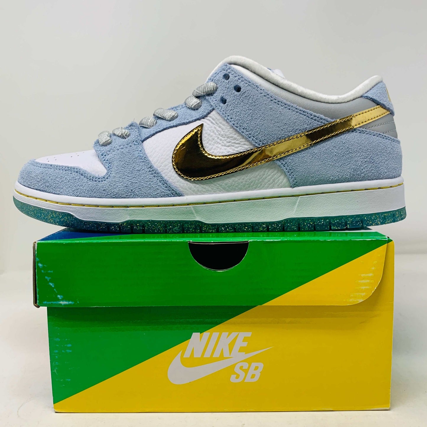 Nike SB Dunk Low Sean Cliver sneakers, brand new condition with extra laces, 2020 release, on a colorful Nike SB box.